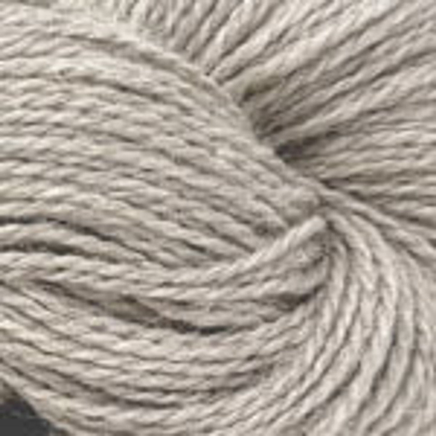 Soft light gray Plymouth Yarn Alpaca Lino skein, perfect for cozy knitwear projects