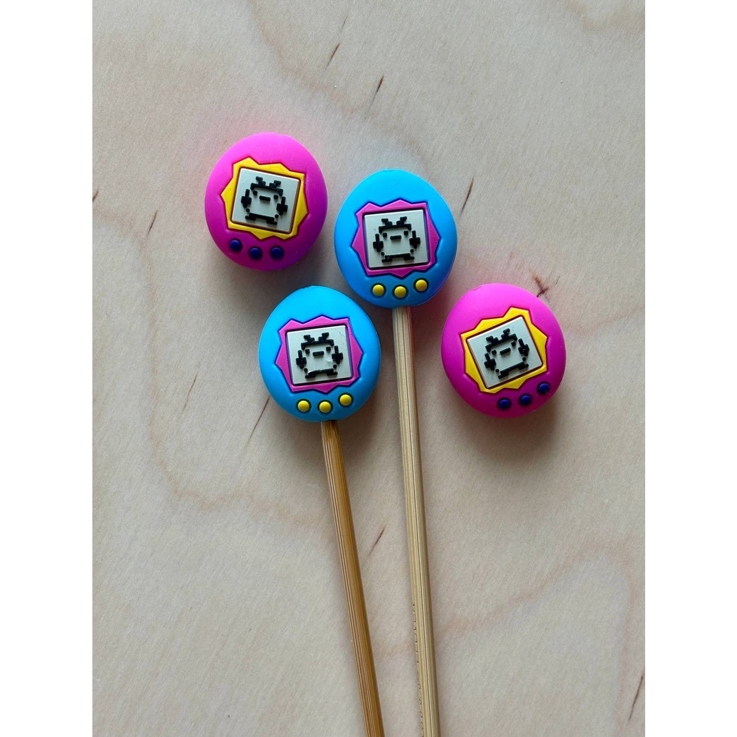 Retro video game store themed cake toppers in vibrant colors featuring pixel art designs