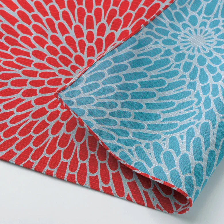 Colorful AriYARN reusable shopping bag featuring a vibrant flower pattern in red and blue
