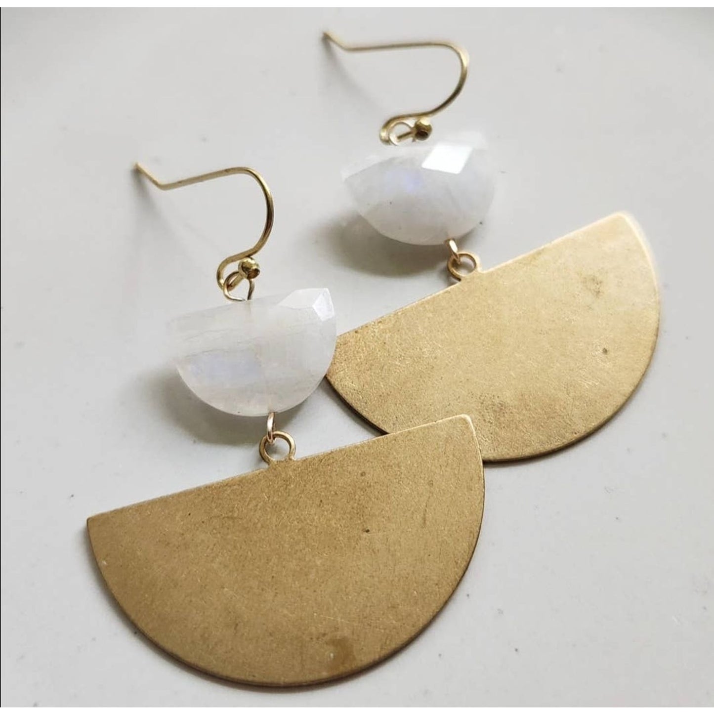 Sara Sela Jewelry crescent rainbow moonstone earrings with faceted moonstones and large brass semicircle drops