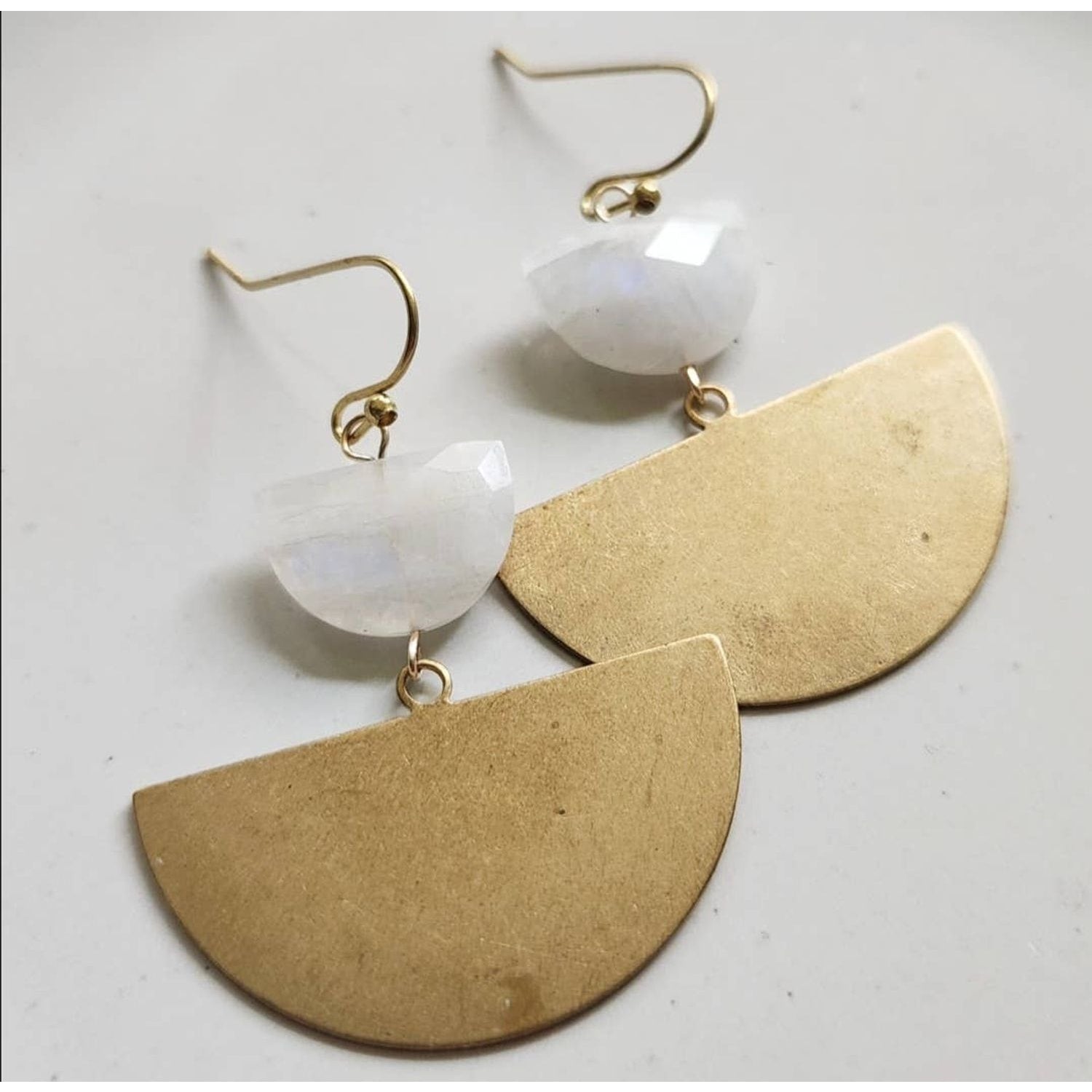 Sara Sela Jewelry crescent rainbow moonstone earrings with faceted moonstones and large brass semicircle drops