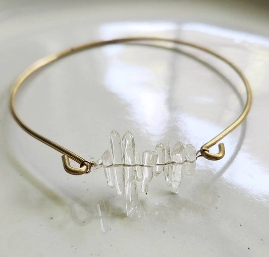Sara Sela Jewelry clear quartz bangle bracelet with raw clear quartz cluster on thin gold wire band