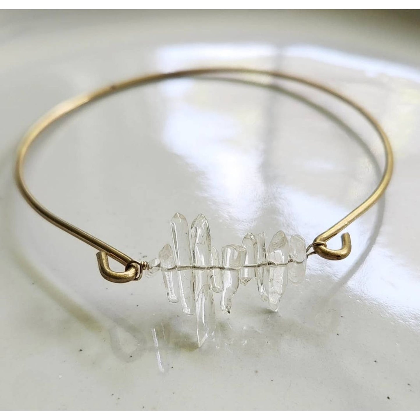 Sara Sela Jewelry clear quartz bangle bracelet with raw clear quartz cluster on thin gold wire band