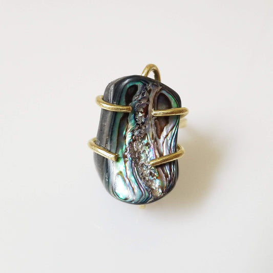 Sara Sela Jewelry rainbow abalone shell ring with gold wire wrap showcasing iridescent green blue purple hues