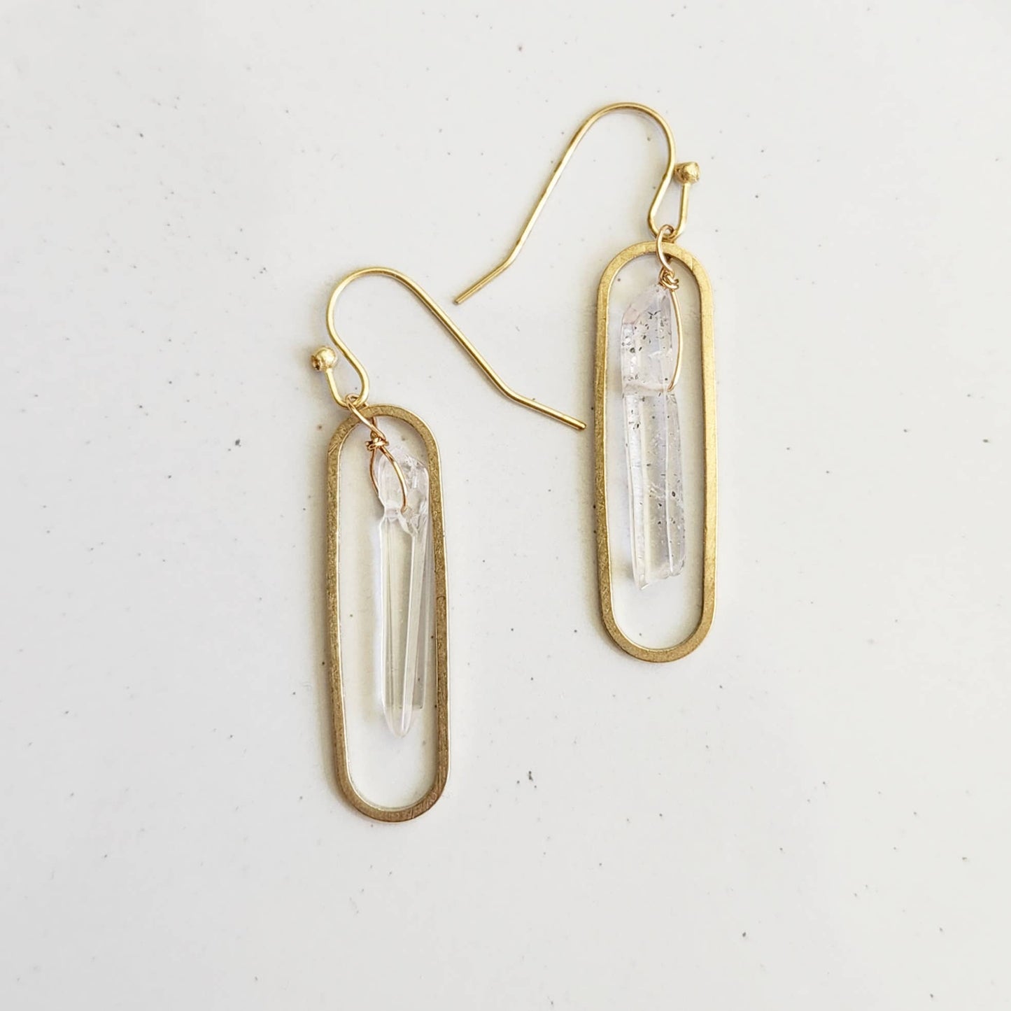 Sara Sela Jewelry gold oval dangle earrings with clear quartz points and wire wrapped quartz crystal earrings