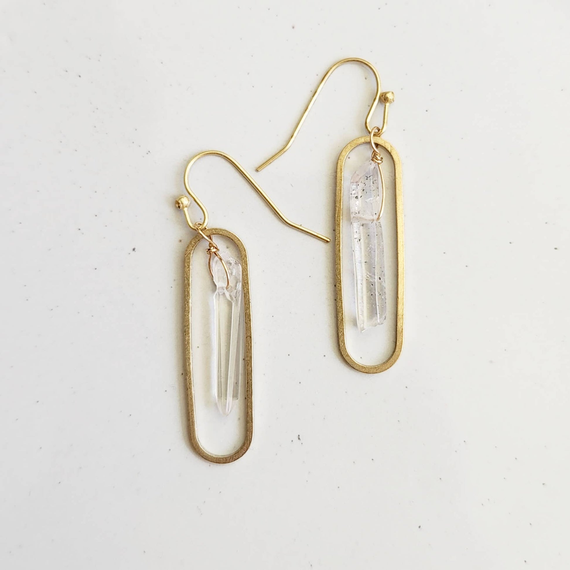 Sara Sela Jewelry gold oval dangle earrings with clear quartz points and wire wrapped quartz crystal earrings