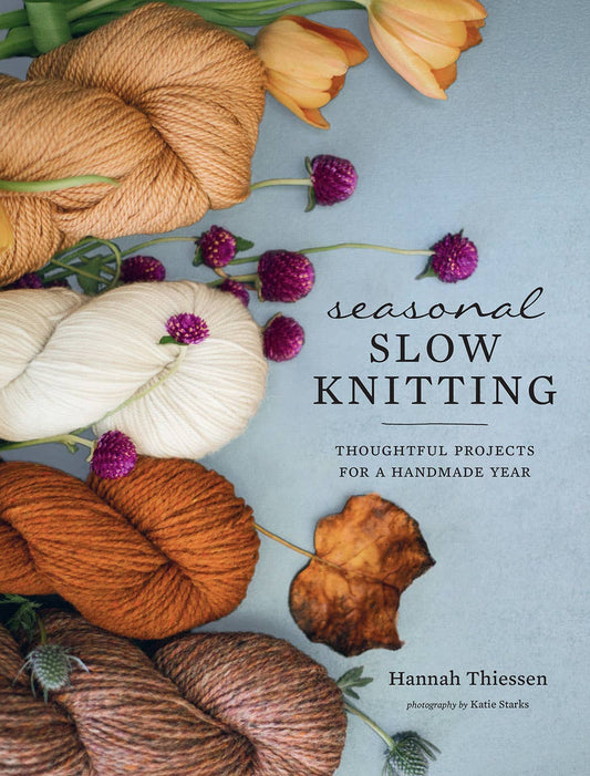 Seasonal slow knitting book cover featuring yarn and flowers with thoughtful projects for a handmade year