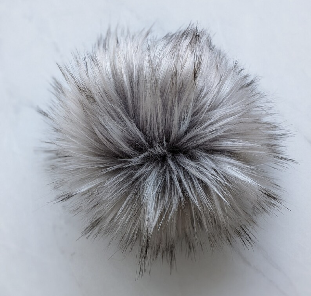 Fluffy silver grey pom pom for knitting, perfect for adding texture to hats and crafts