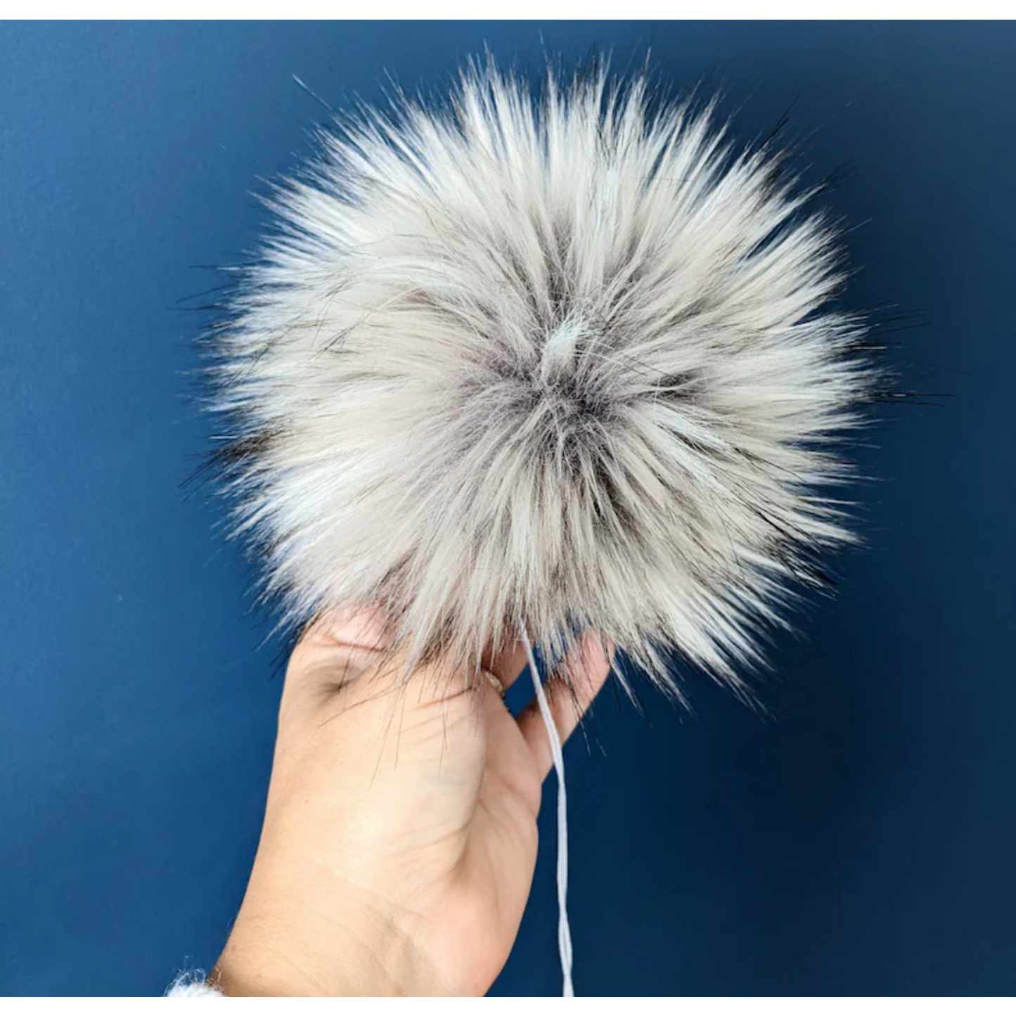 Fluffy silver grey pom pom for knitting, perfect for hats and accessories