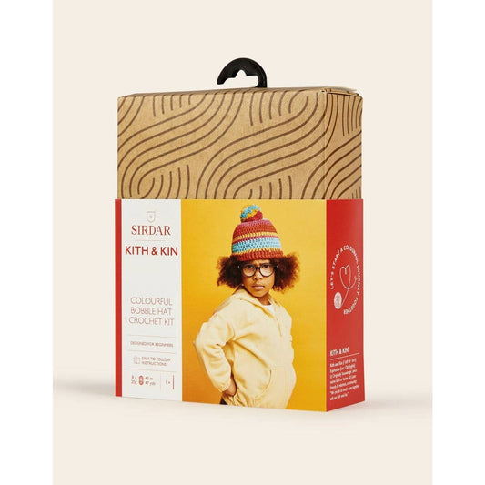 DMC kit a crochet for a colorful bobble hat featuring a child model wearing the finished product