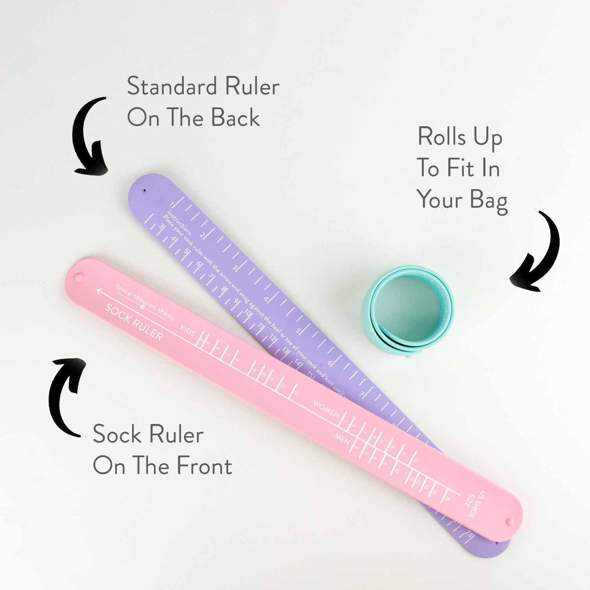 Twice Sheared Sheep sock sizing ruler in pink and purple, rolls up for easy storage