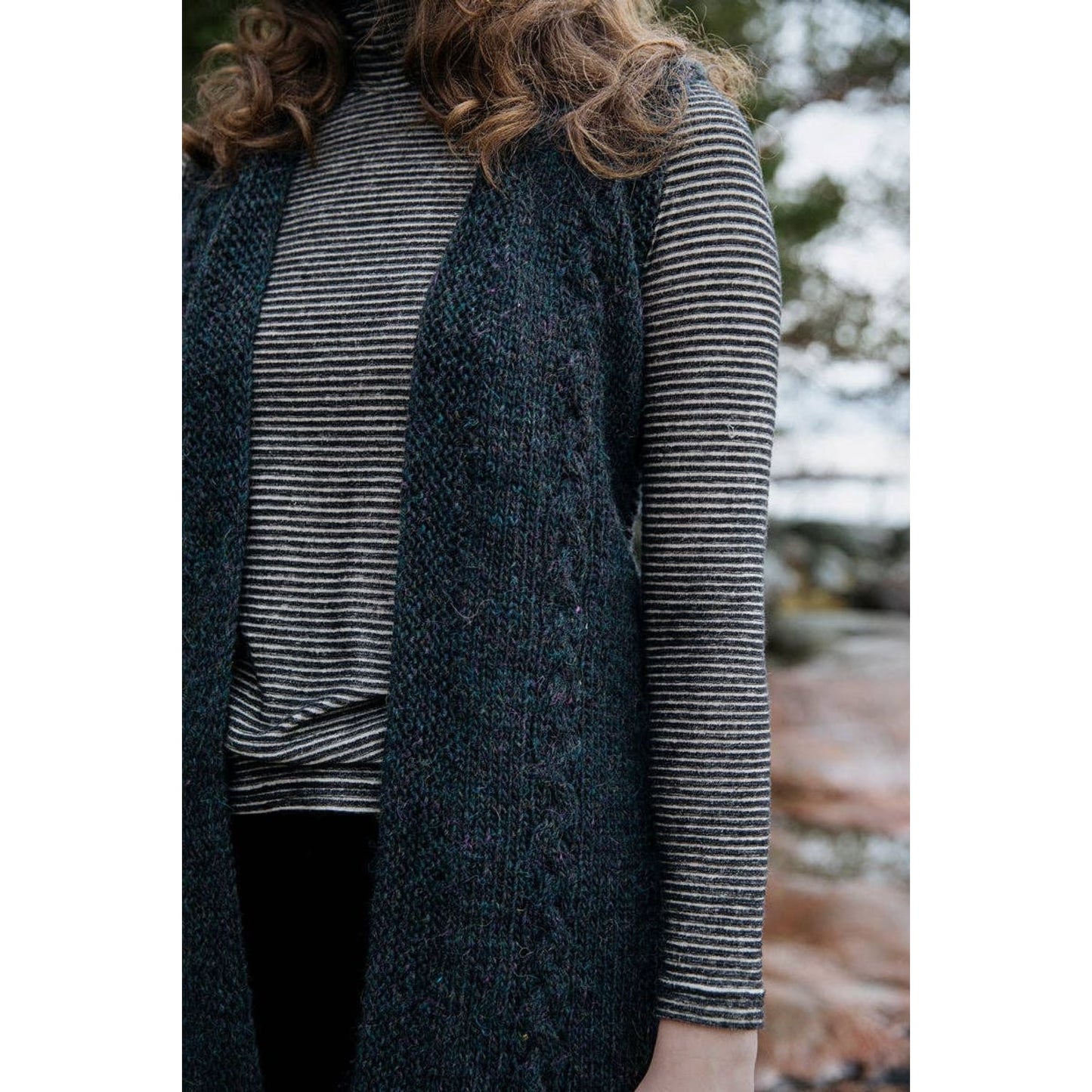 Model wearing a stylish knitted vest from Laine Publishing's Soothing Stitches knitting book