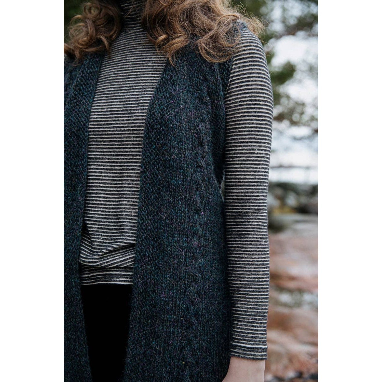 Model wearing a stylish knitted vest from Laine Publishing's Soothing Stitches knitting book