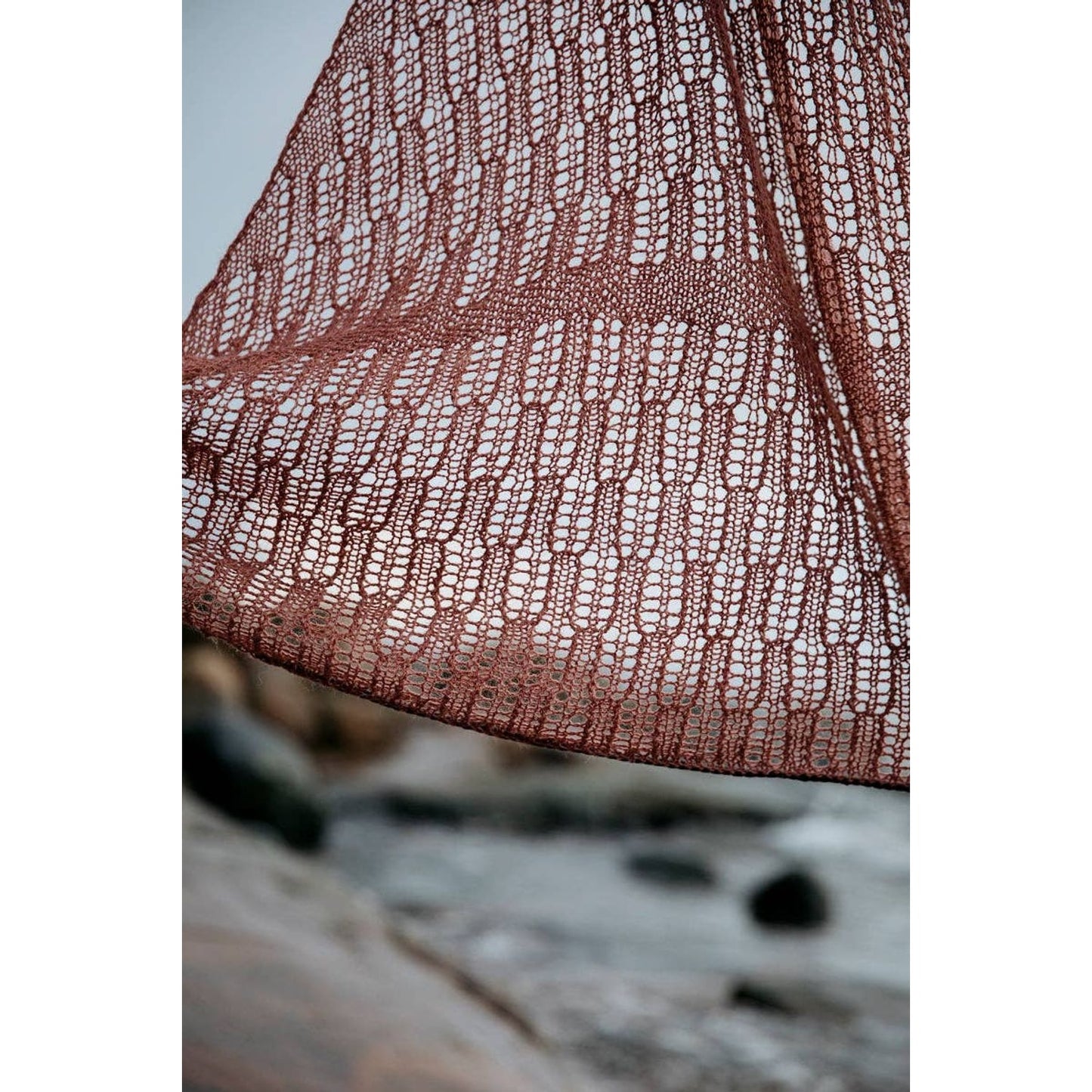 Soothing Stitches knitting book featuring a delicate lace shawl design in earthy tones