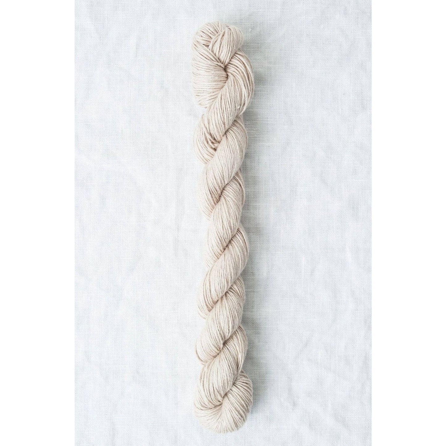 Sparrow organic linen yarn in a soft beige color, perfect for lightweight garments and accessories