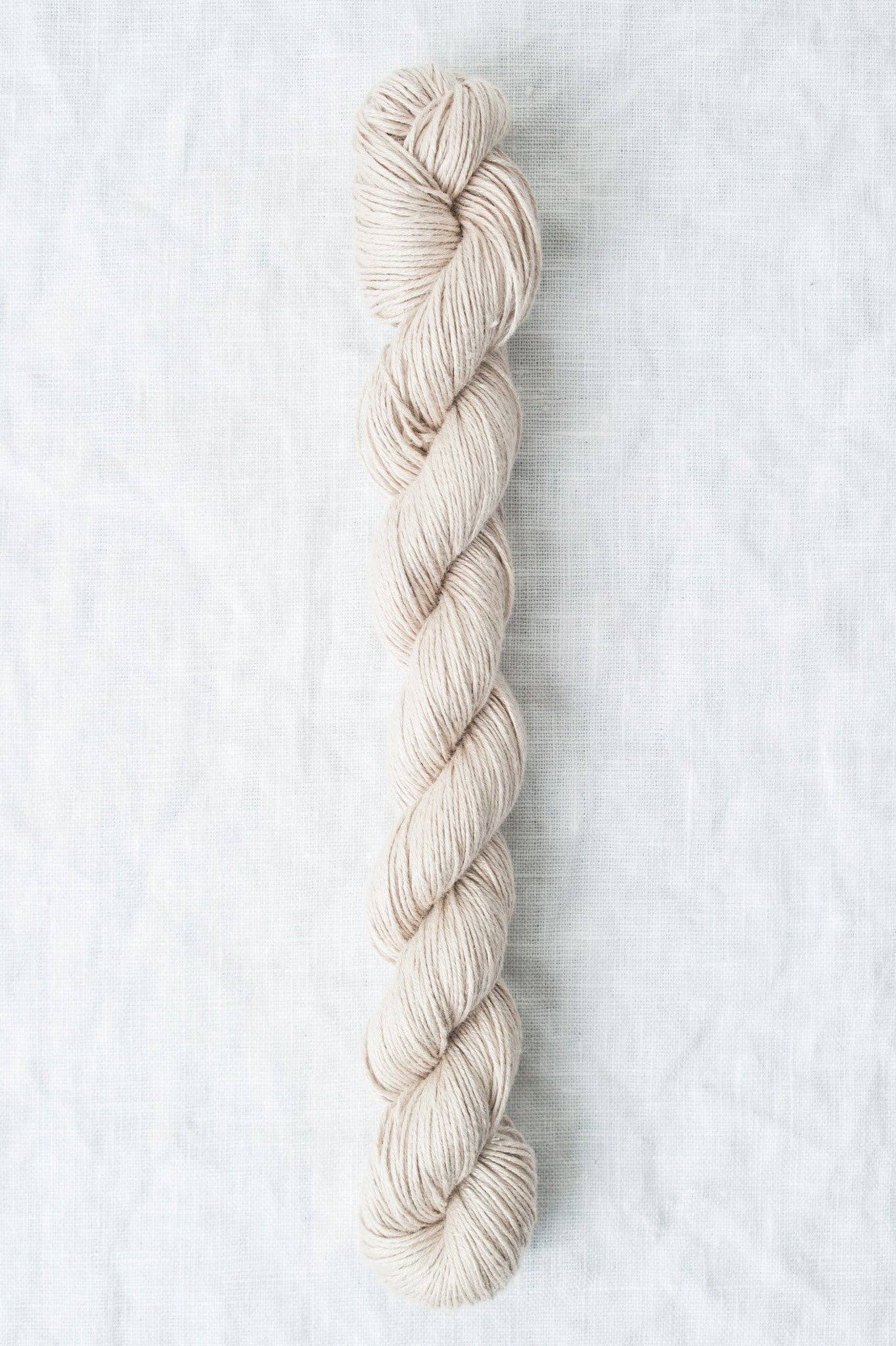 Sparrow organic linen yarn in a soft beige color, perfect for lightweight garments and accessories