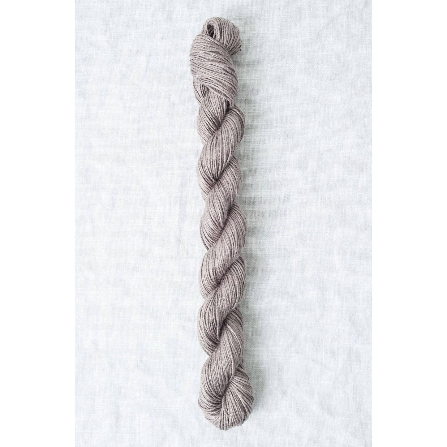 Sparrow organic linen yarn in a soft taupe color, perfect for lightweight garments and accessories