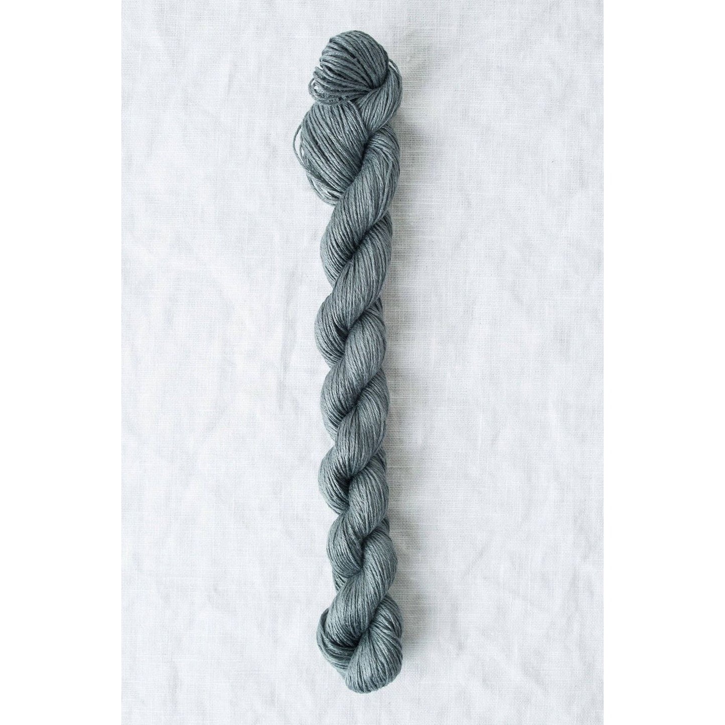 Sparrow organic linen yarn in a soft gray color, perfect for lightweight knitting projects