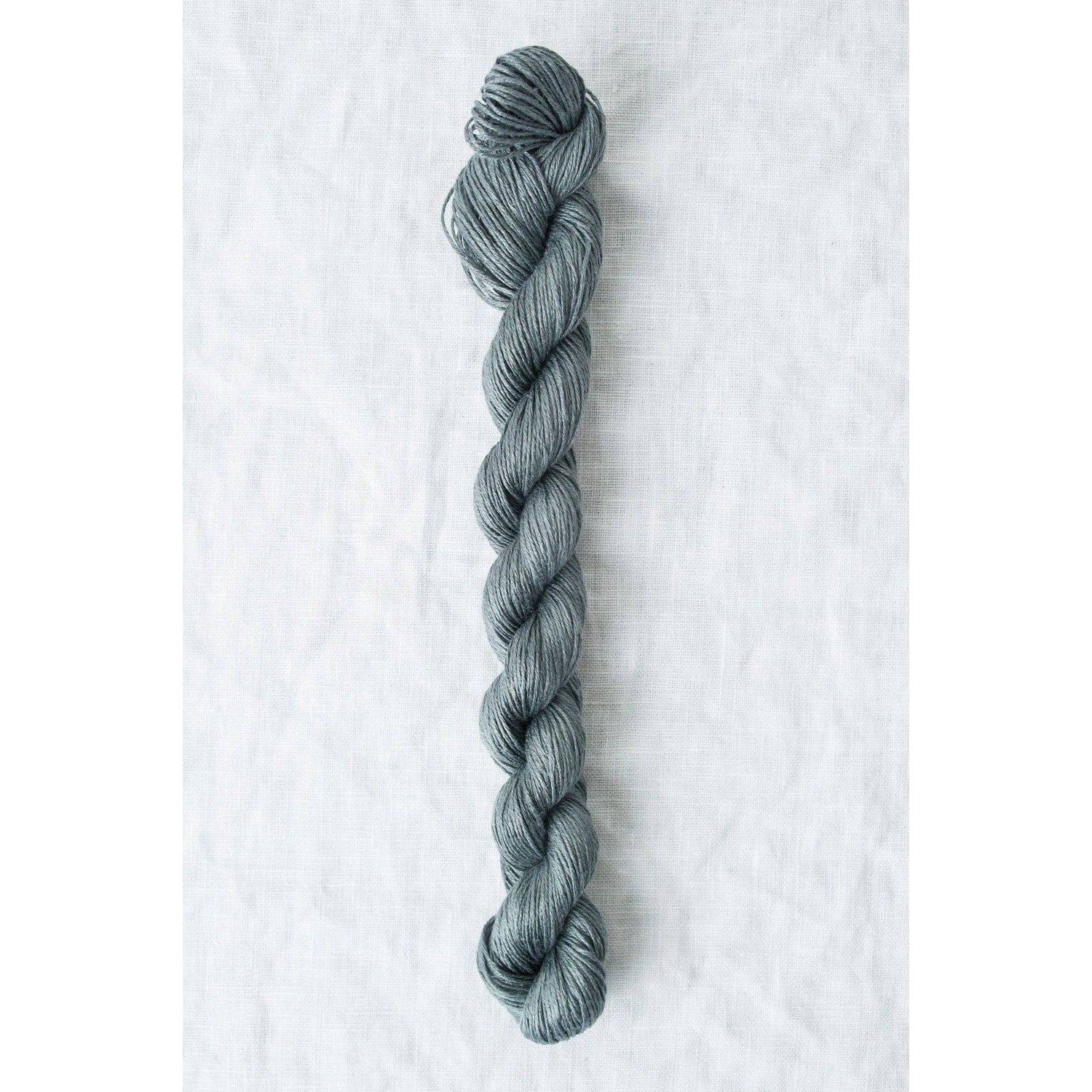 Sparrow organic linen yarn in a soft gray color, perfect for lightweight knitting projects