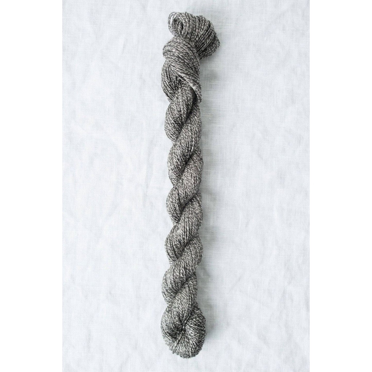 Twisted gray Sparrow organic linen yarn by Quince & Co, perfect for lightweight knitting projects