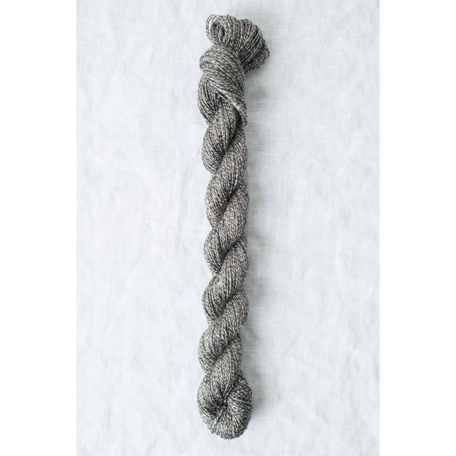 Twisted gray Sparrow organic linen yarn by Quince & Co, perfect for lightweight knitting projects