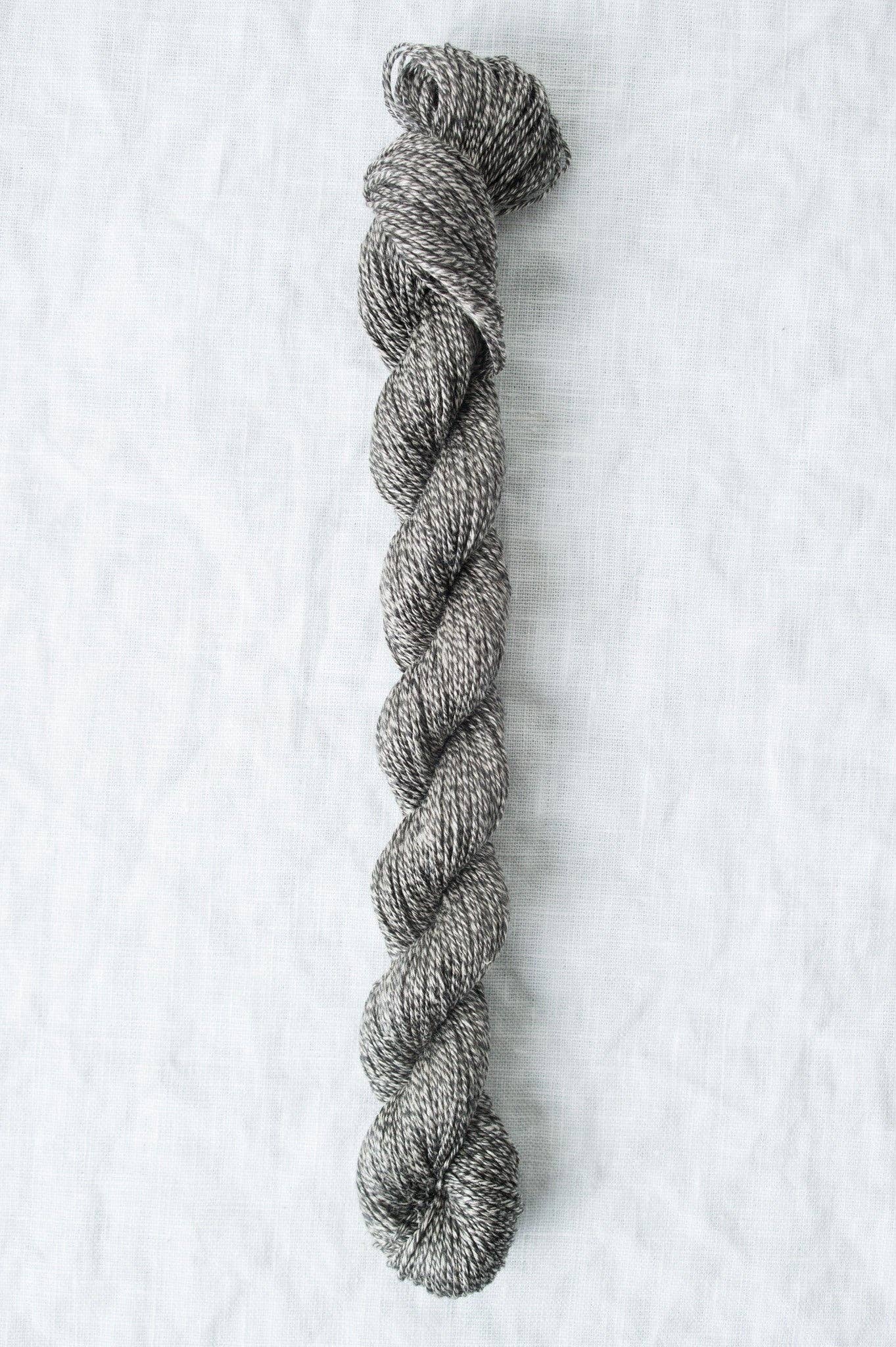 Twisted gray Sparrow organic linen yarn by Quince & Co, perfect for lightweight knitting projects