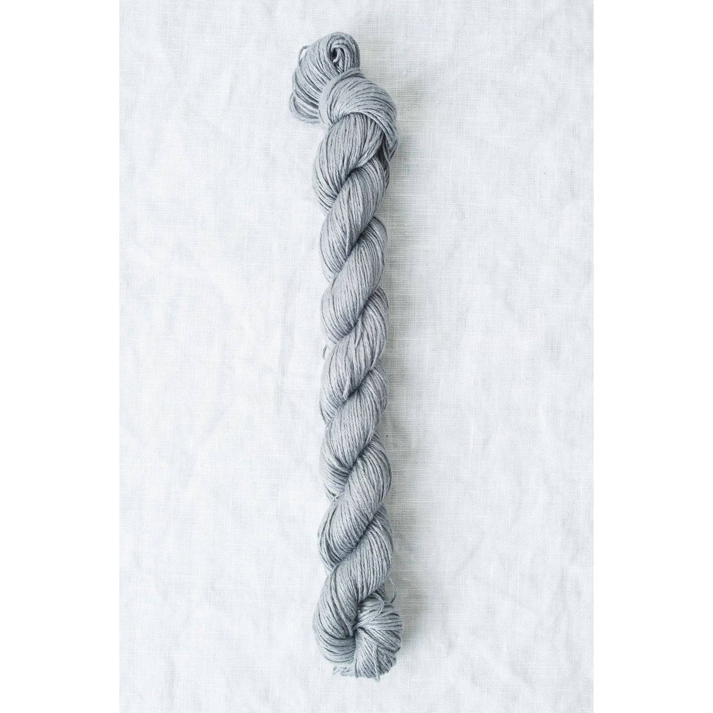 Sleek gray Sparrow organic linen yarn from Quince & Co, ideal for knitting and crochet projects