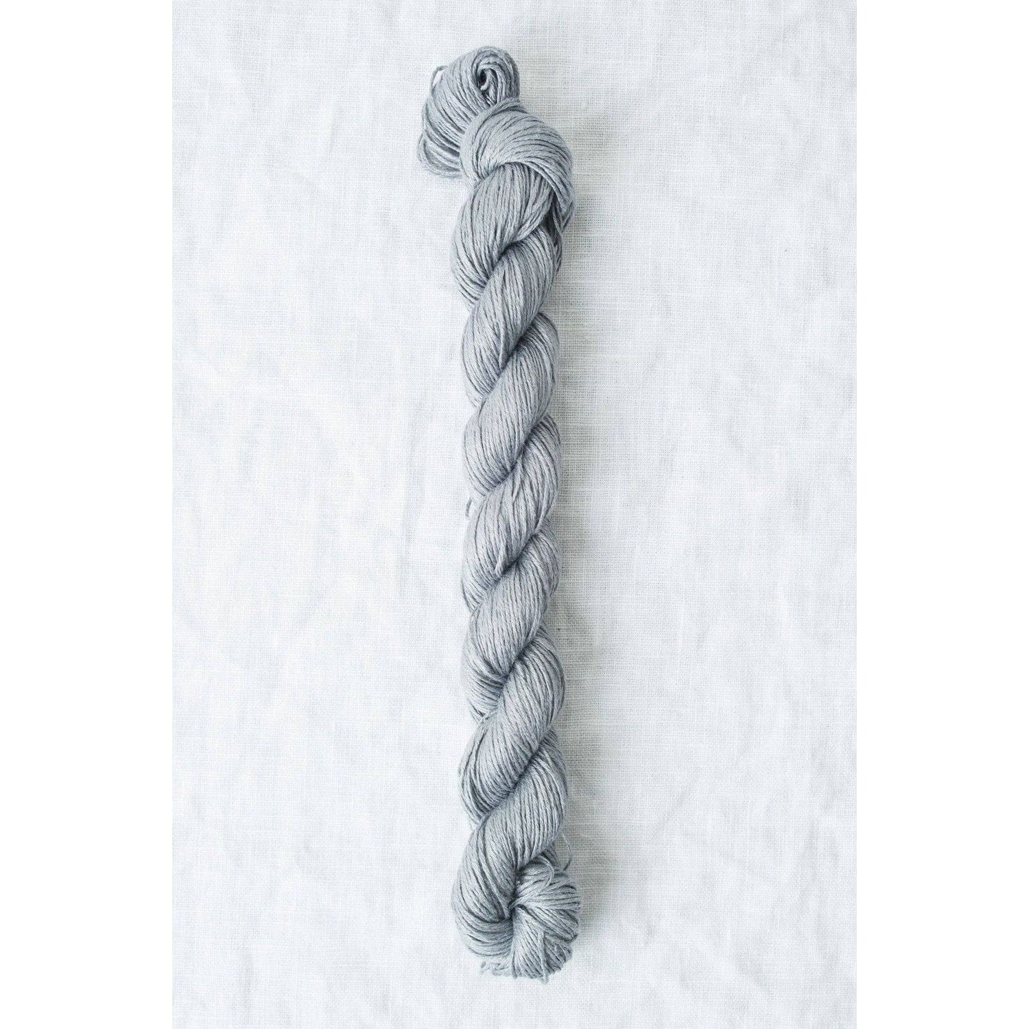 Sleek gray Sparrow organic linen yarn from Quince & Co, ideal for knitting and crochet projects