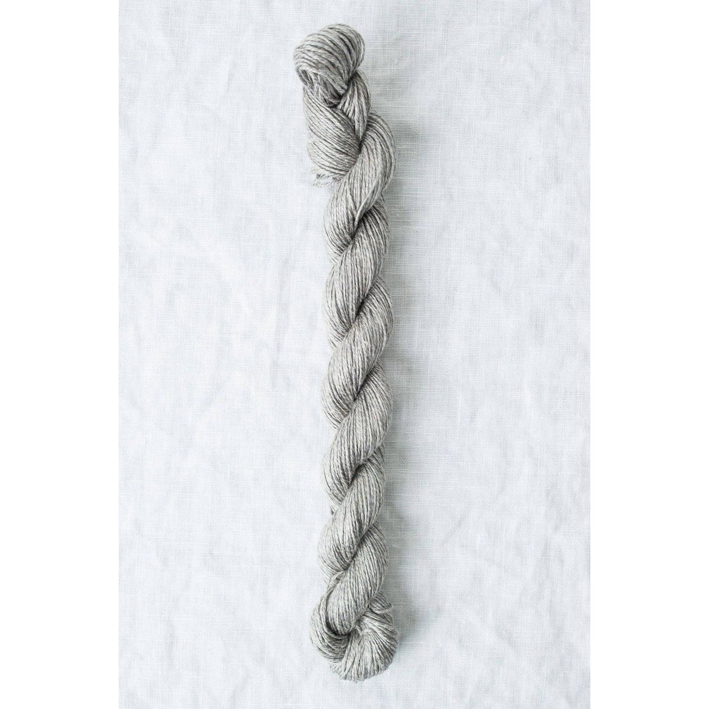 Sparrow organic linen yarn by Quince & Co in a soft gray color, perfect for knitting and crochet projects.
