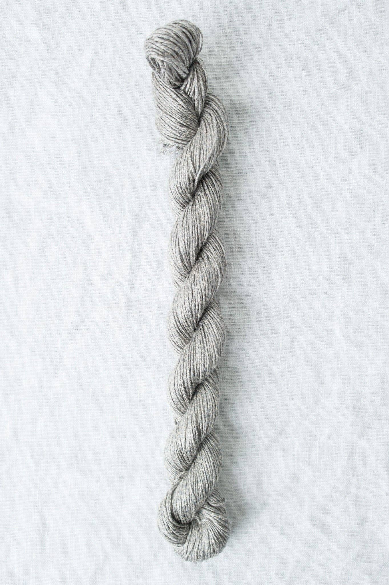 Sparrow organic linen yarn by Quince & Co in a soft gray color, perfect for knitting and crochet projects.