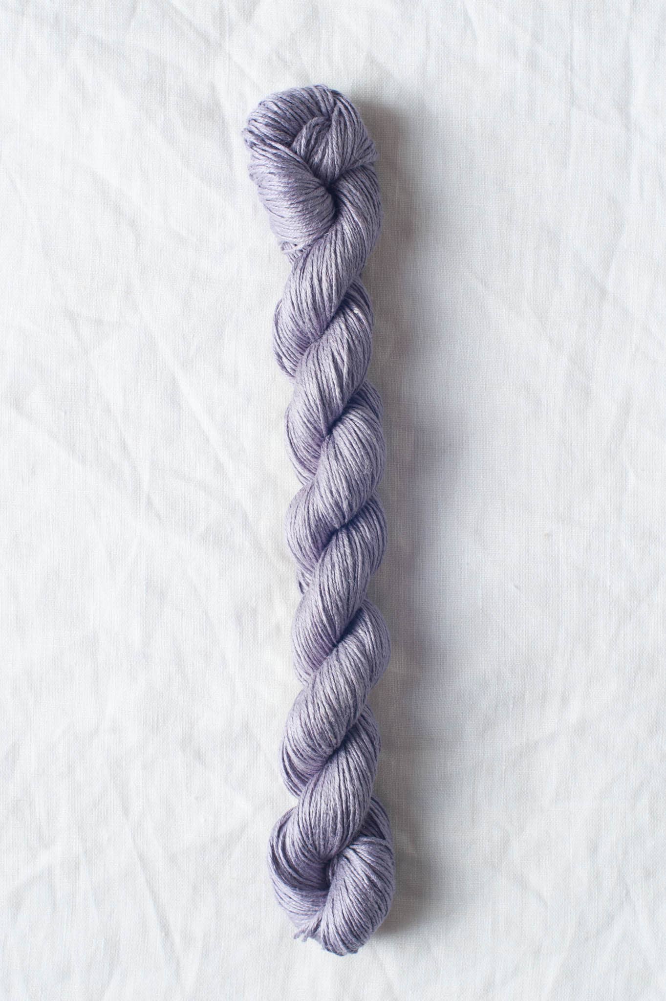 Sparrow organic linen yarn in soft lavender color perfect for eco-friendly knitting projects
