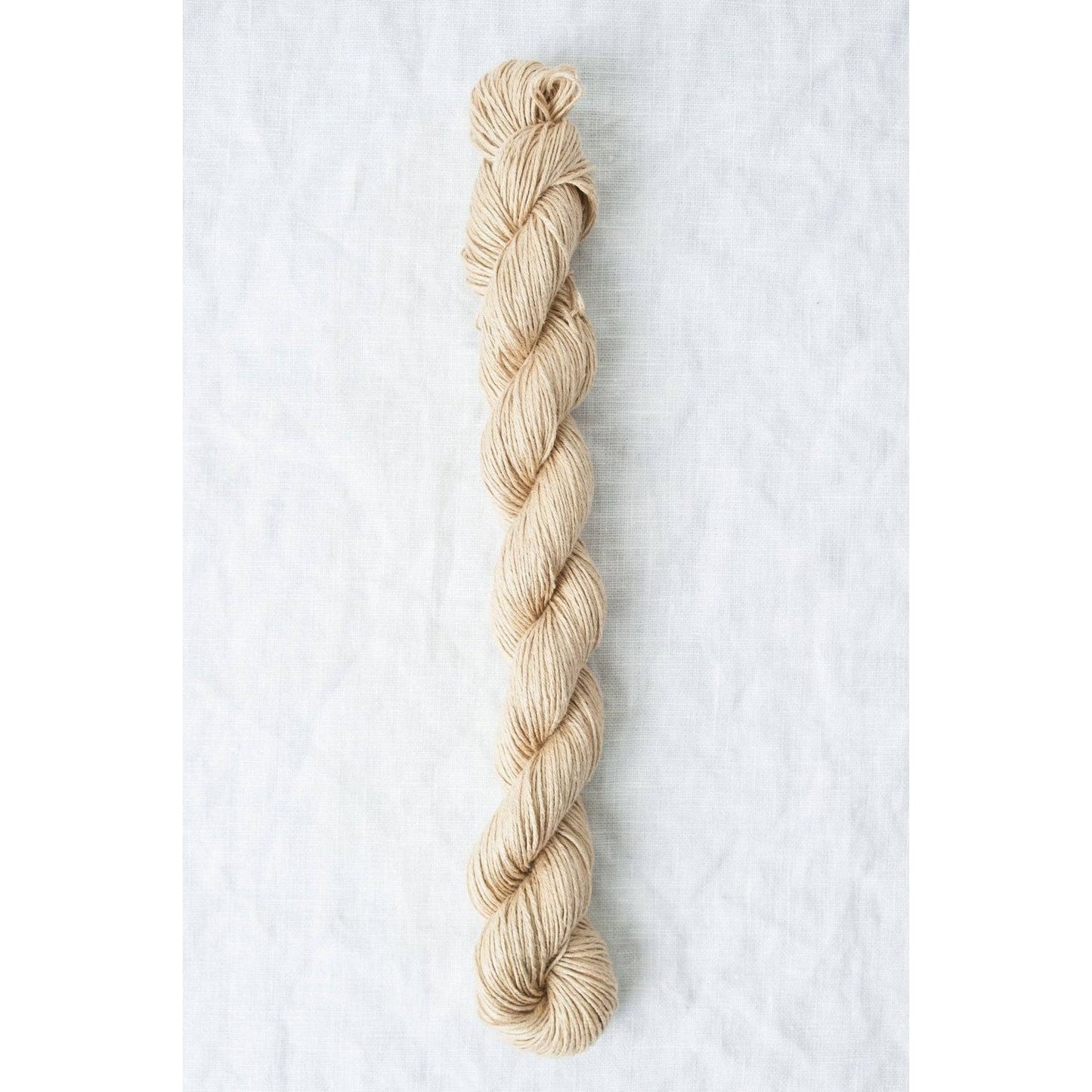 Sparrow organic linen yarn in natural beige color, ideal for eco-friendly knitting projects