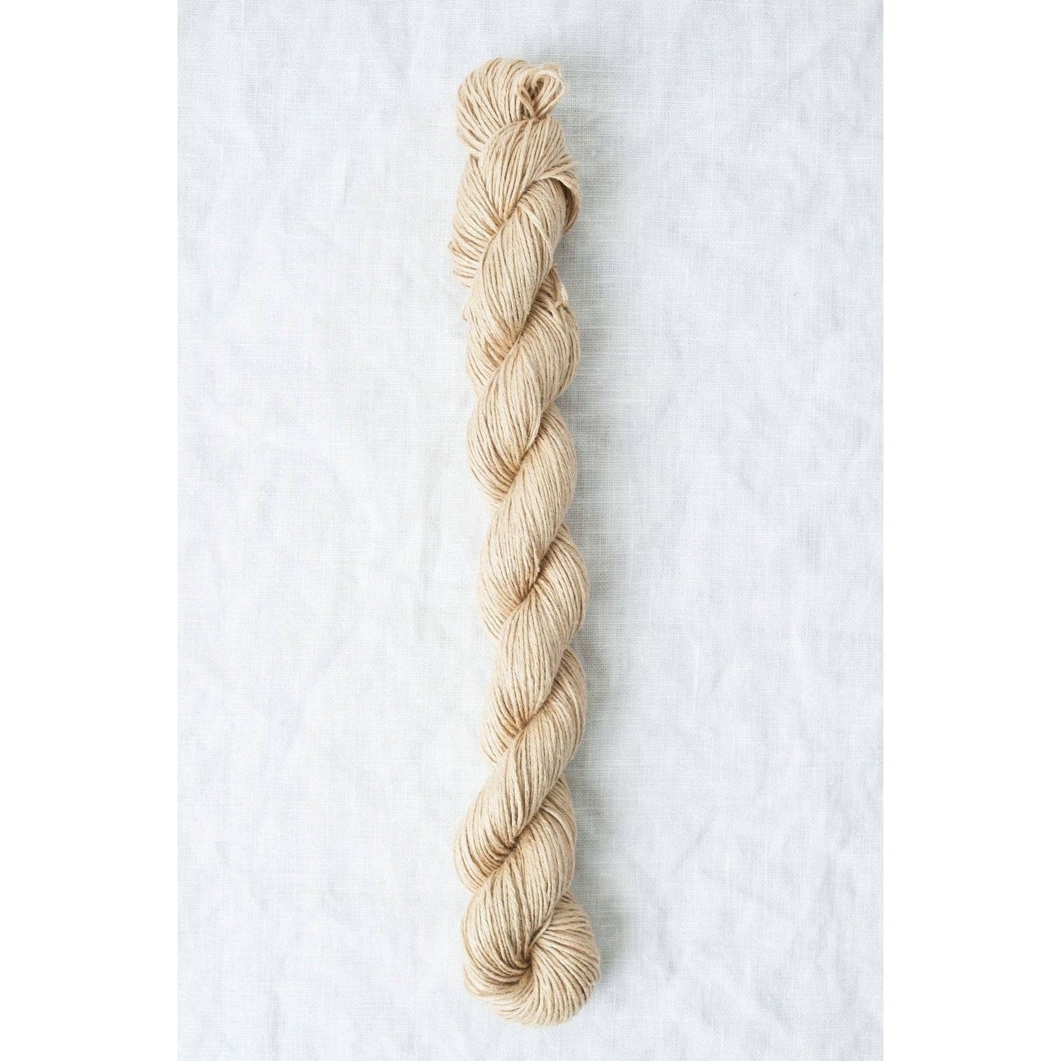 Sparrow organic linen yarn in natural beige color, ideal for eco-friendly knitting projects