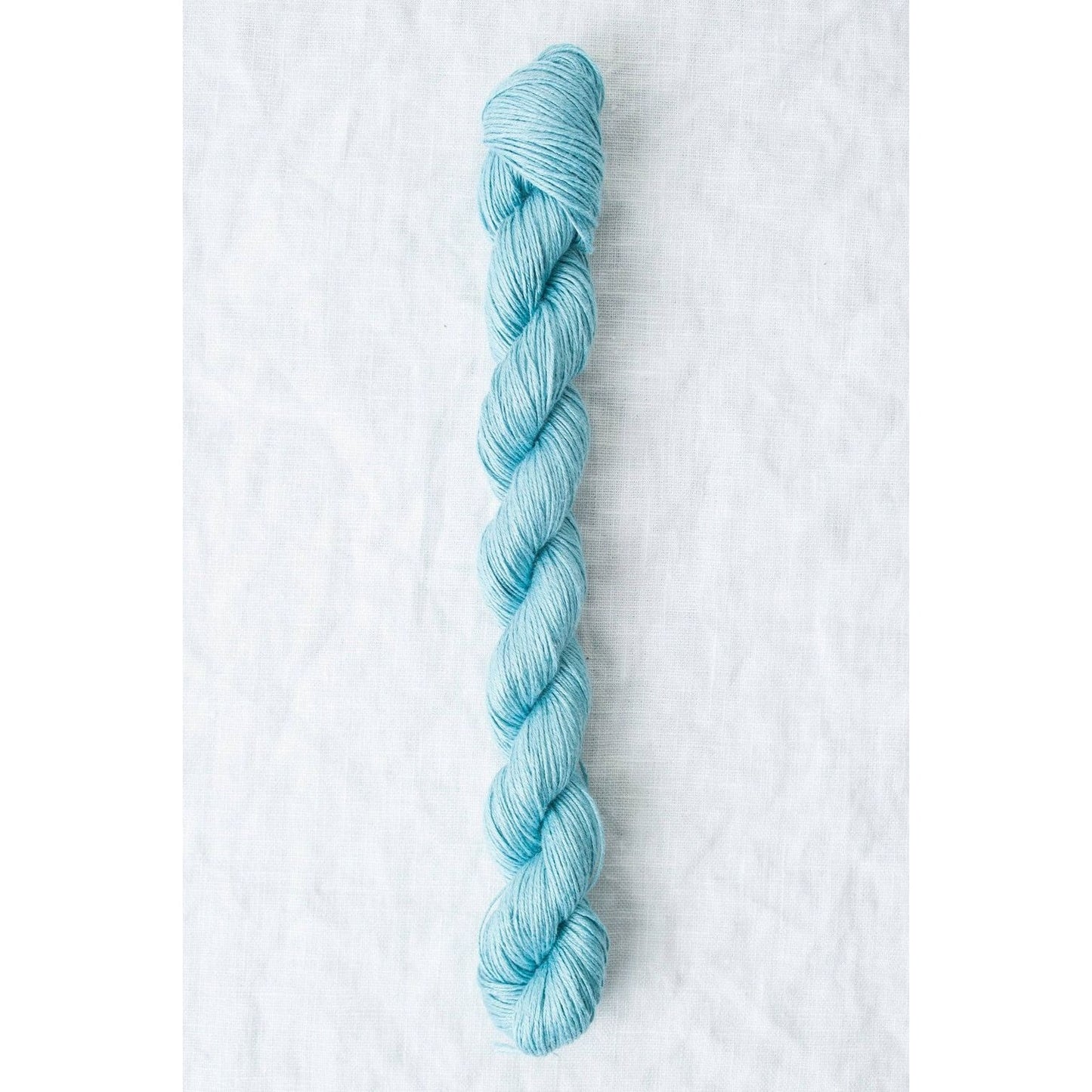 Sparrow organic linen yarn in soft blue color, perfect for lightweight summer projects
