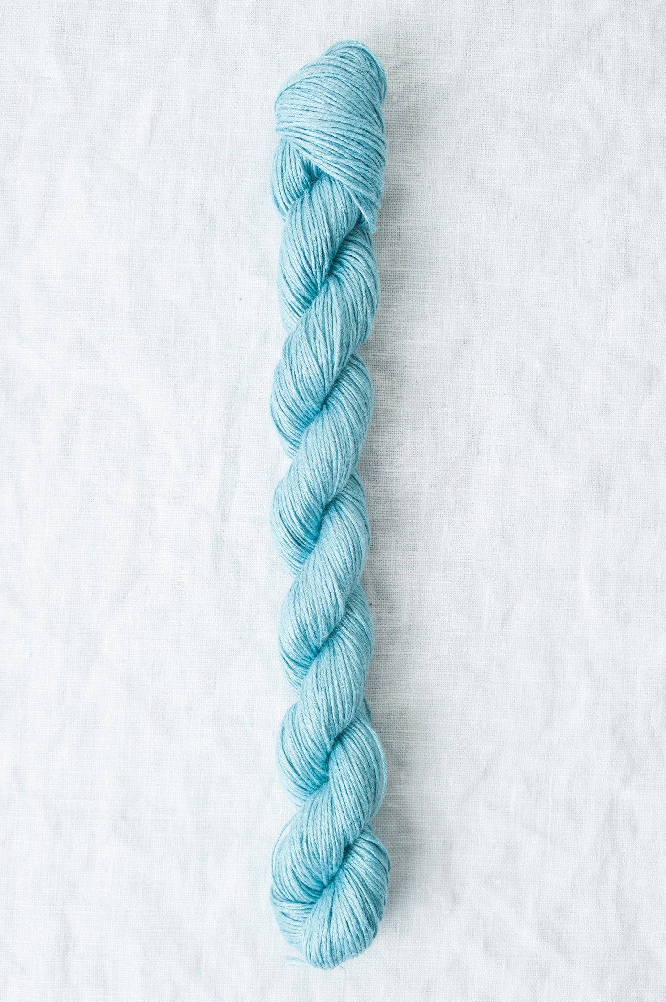 Sparrow organic linen yarn in soft blue color, perfect for lightweight summer projects