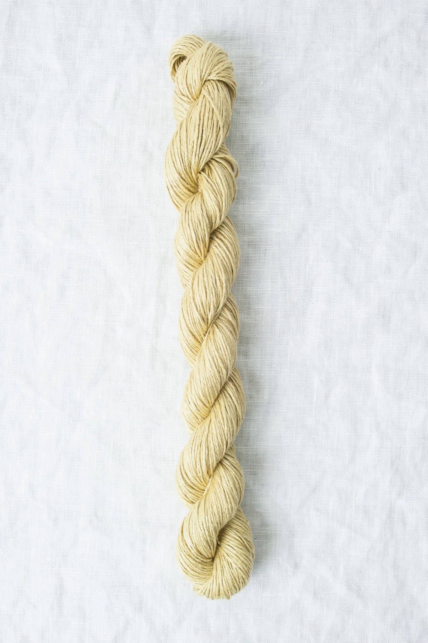 Skein of Quince & Co. Sparrow organic linen yarn in a natural beige color