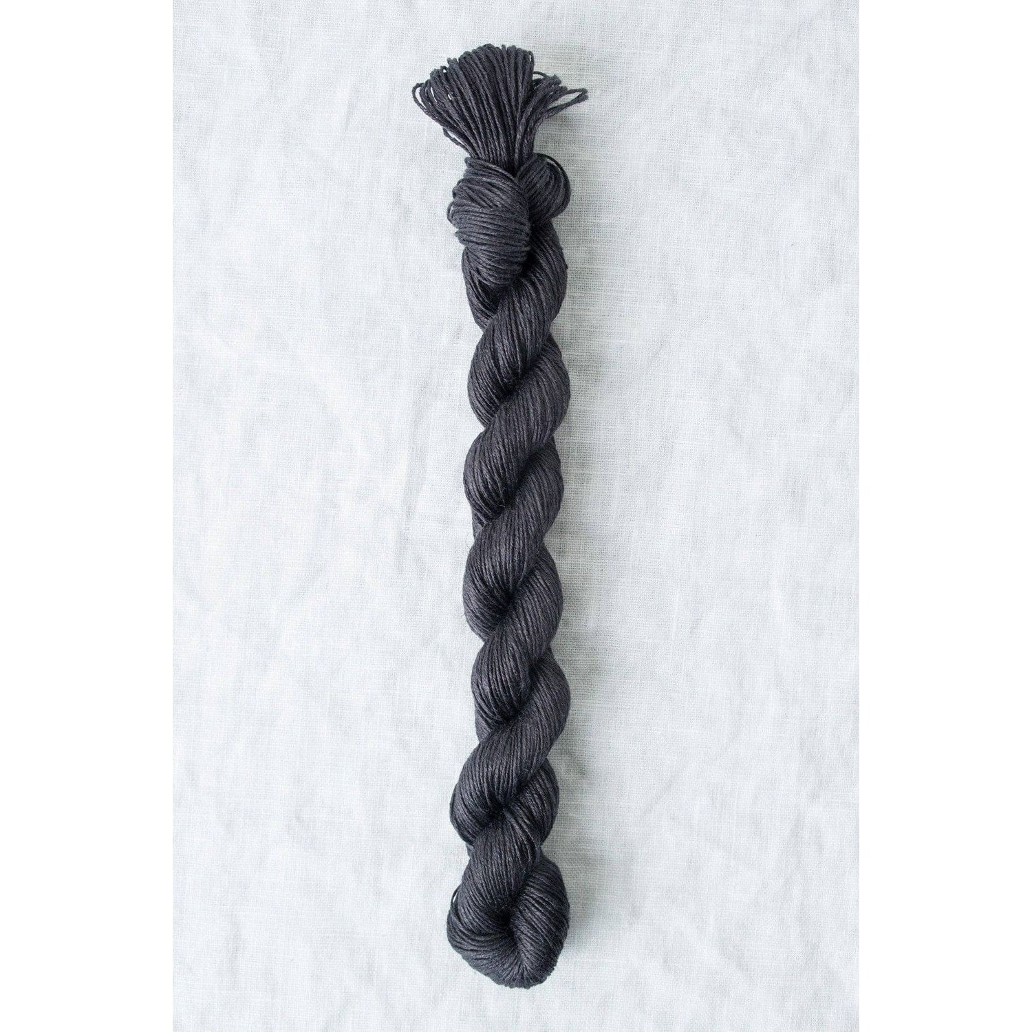 Quince & Co. Sparrow organic linen yarn in a rich dark gray color for knitting and crocheting projects