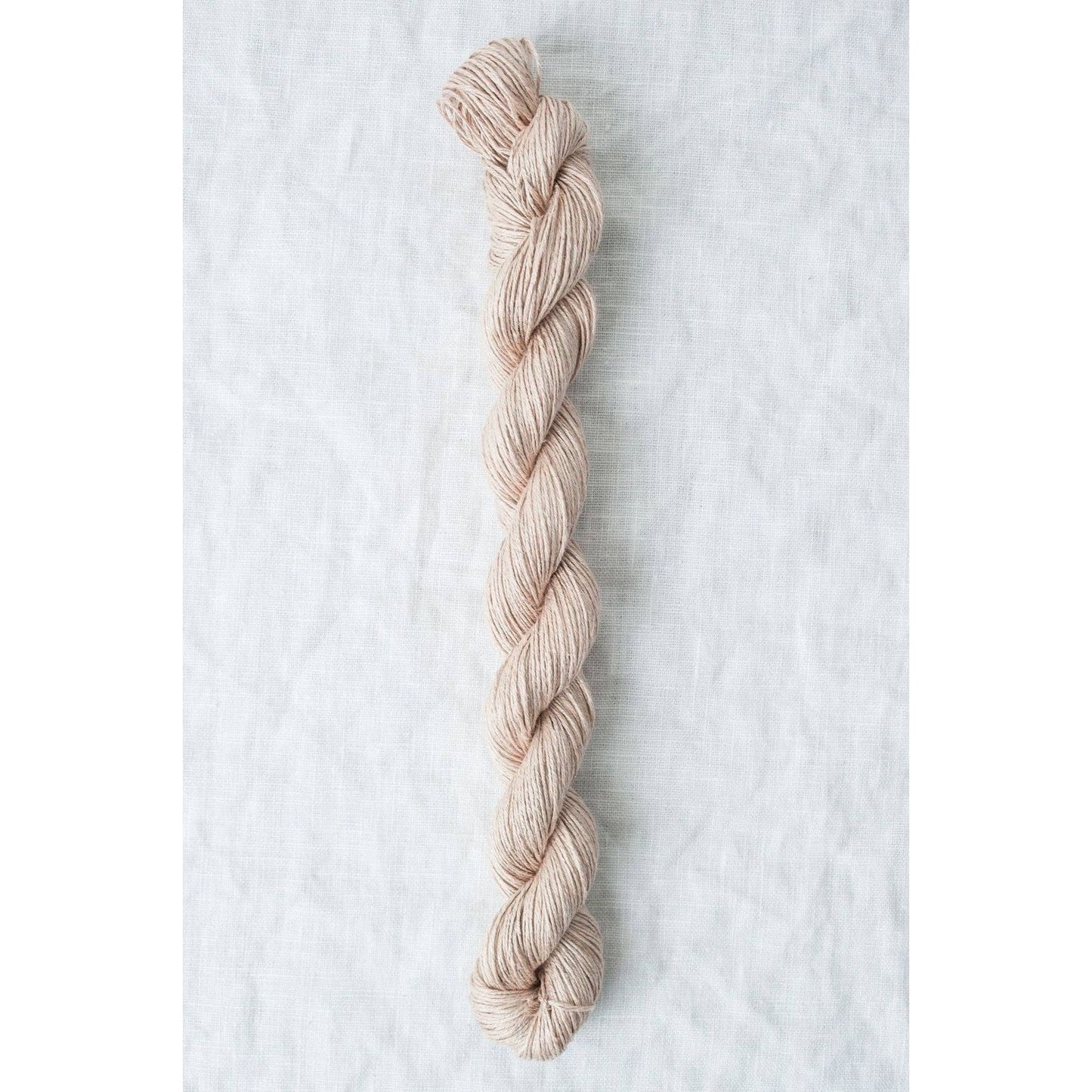 Light pink Sparrow organic linen yarn from Quince & Co. for eco-friendly knitting projects