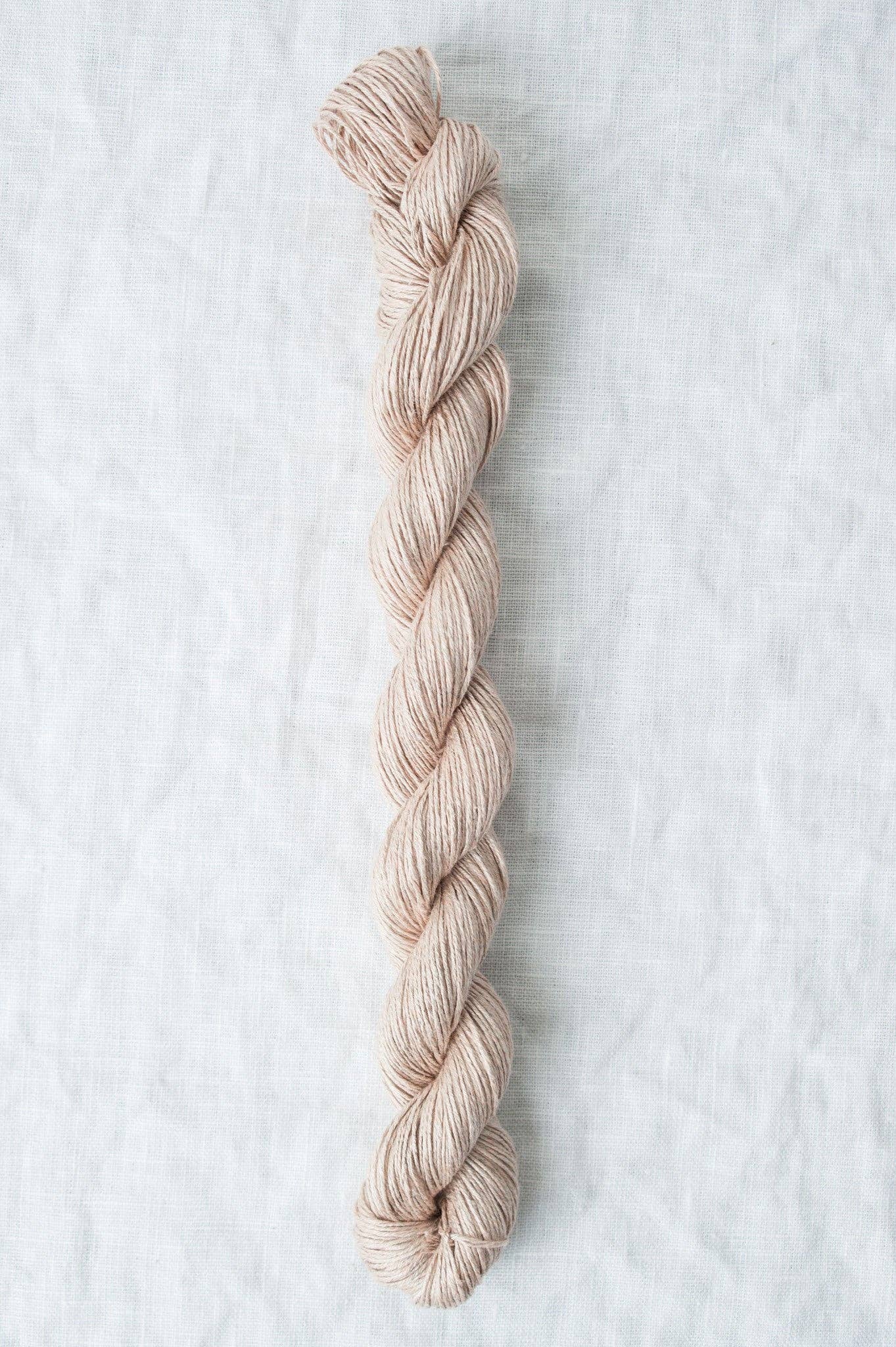 Light pink Sparrow organic linen yarn from Quince & Co. for eco-friendly knitting projects