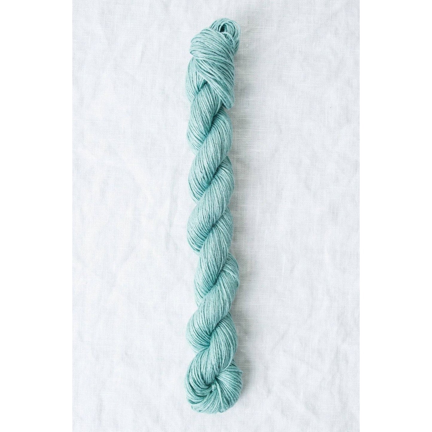 Sparrow organic linen yarn in soft blue, perfect for eco-friendly knitting and crochet projects