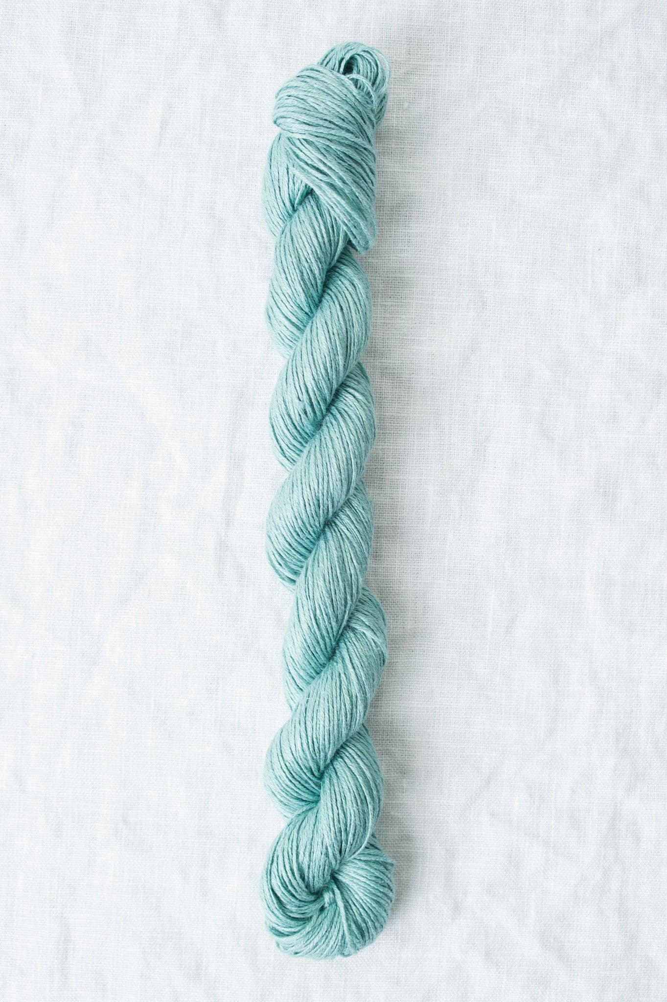 Sparrow organic linen yarn in soft blue, perfect for eco-friendly knitting and crochet projects