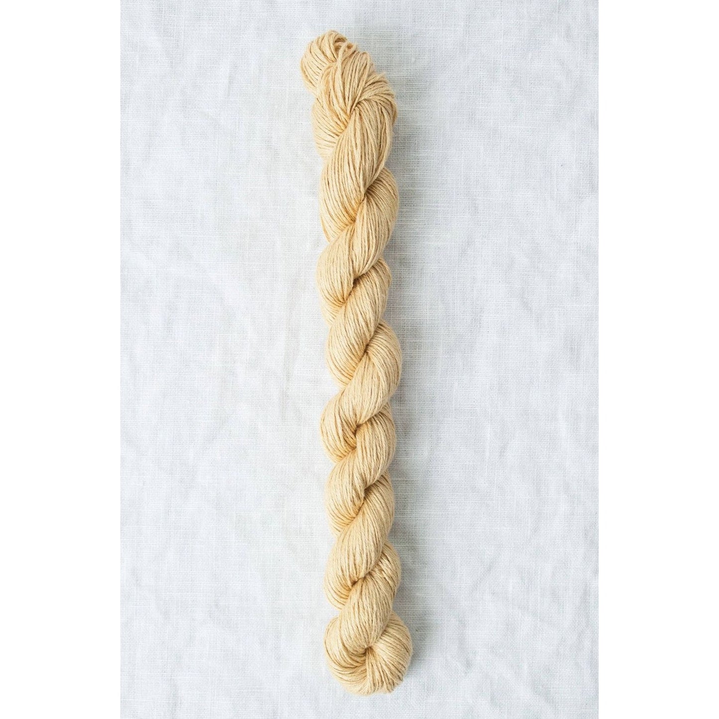 Quince & Co. Sparrow organic linen yarn in a soft beige color, perfect for eco-friendly knitting projects