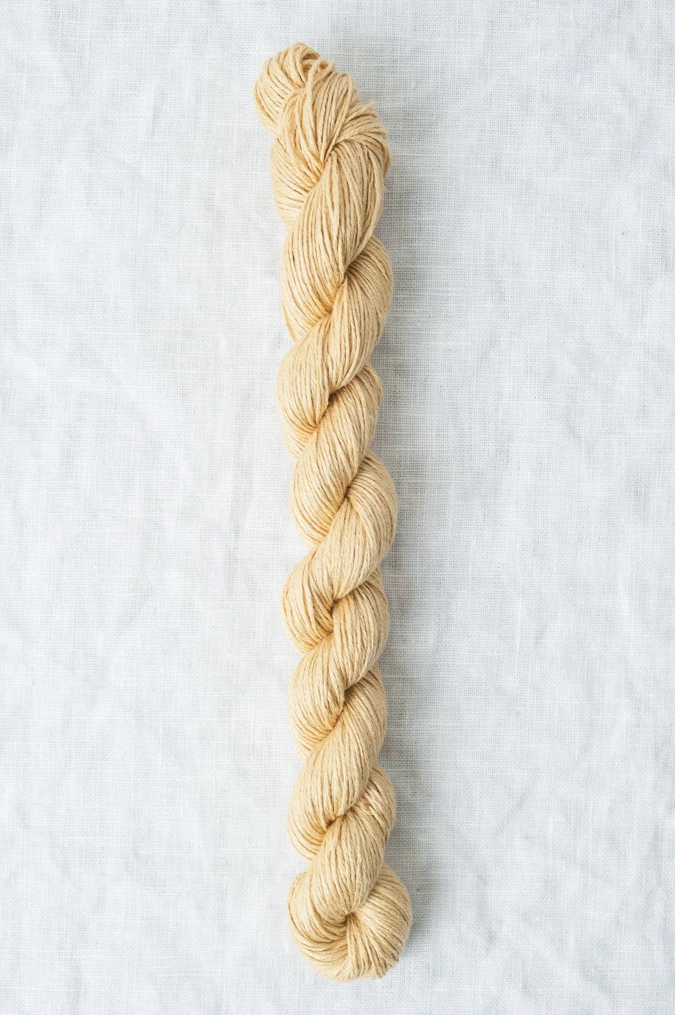 Quince & Co. Sparrow organic linen yarn in a soft beige color, perfect for eco-friendly knitting projects