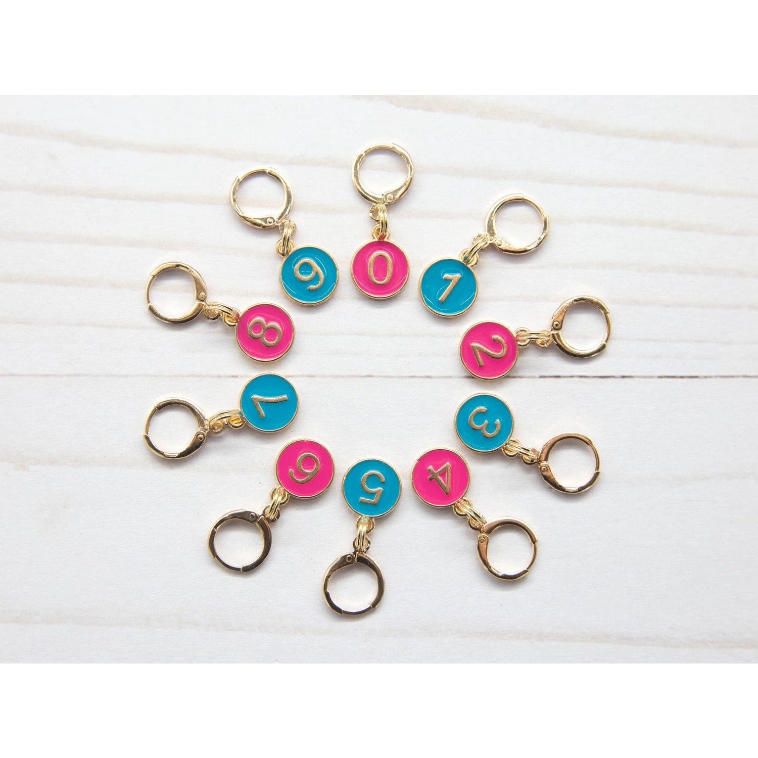 Colorful stitch markers for crocheting with numbered designs for easy project tracking