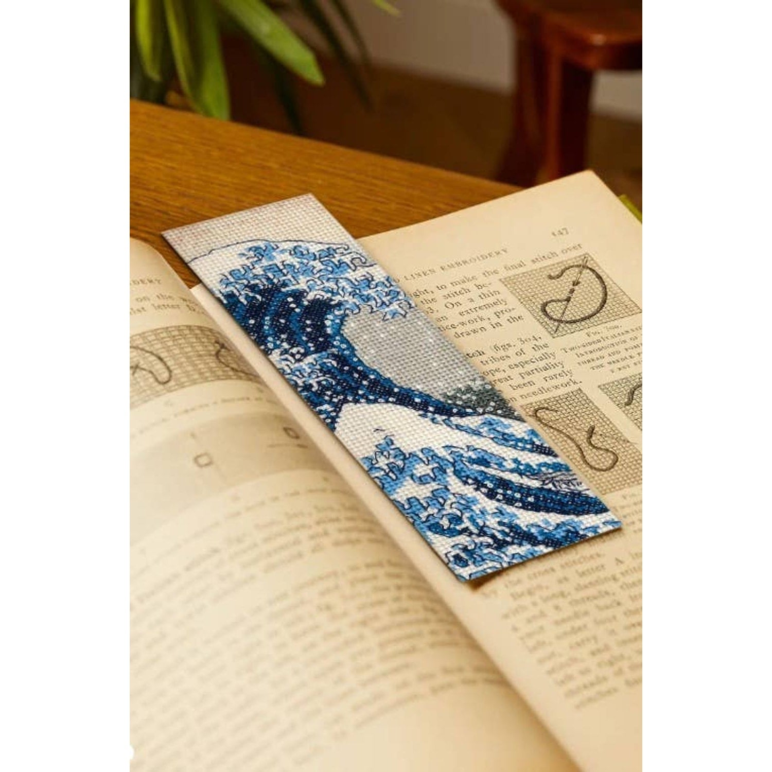 DMC cross stitch bookmark featuring a blue wave design perfect for stitching enthusiasts