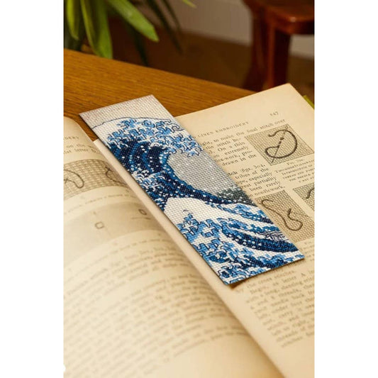 DMC cross stitch bookmark featuring a blue wave design perfect for stitching enthusiasts