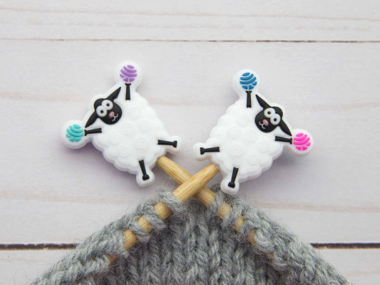 Fox and Pine Stitches sheep stitch markers on wooden knitting needles with gray yarn for knitters