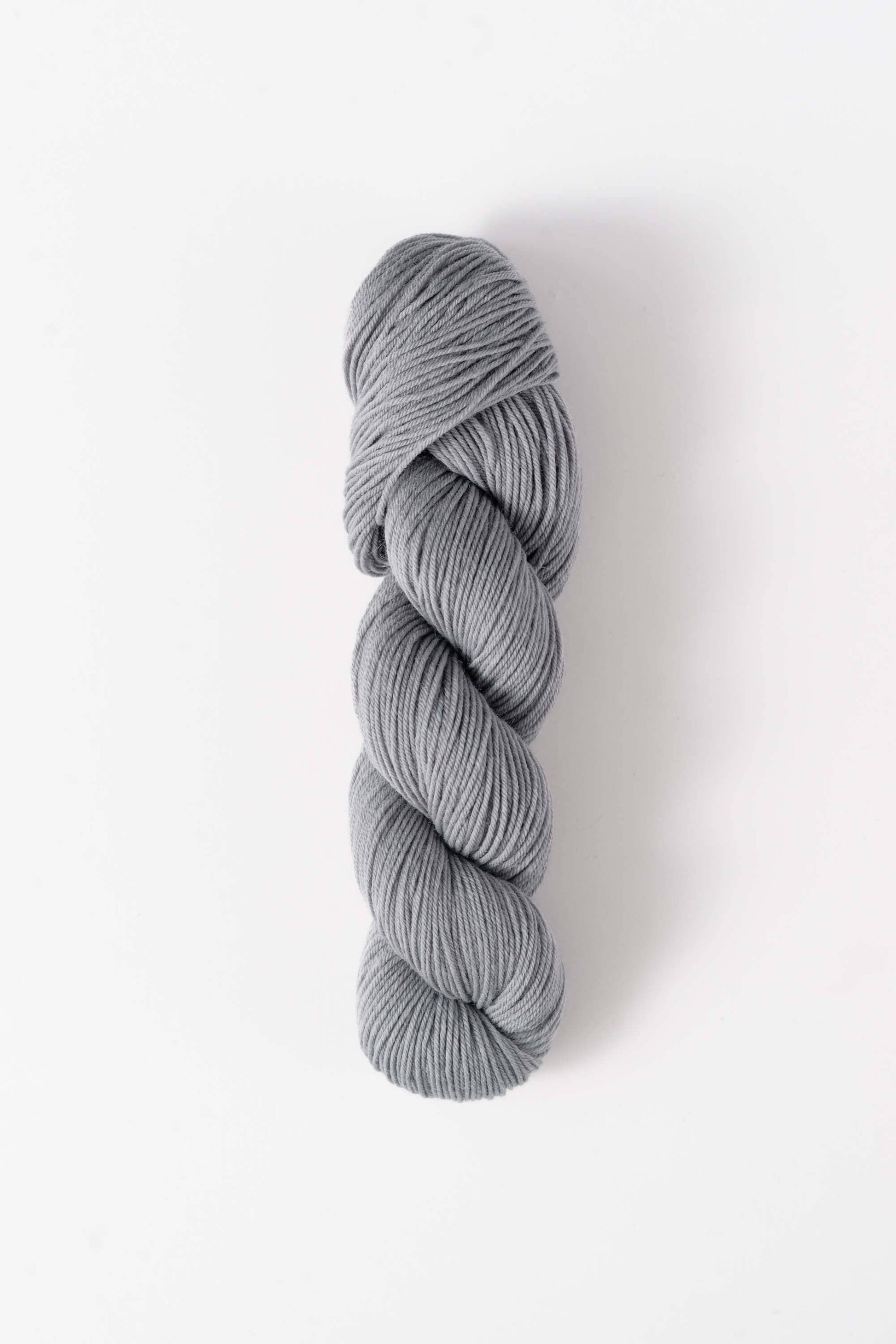 Quince & Co. light gray superwash merino fingering yarn skein for knitting and crocheting
