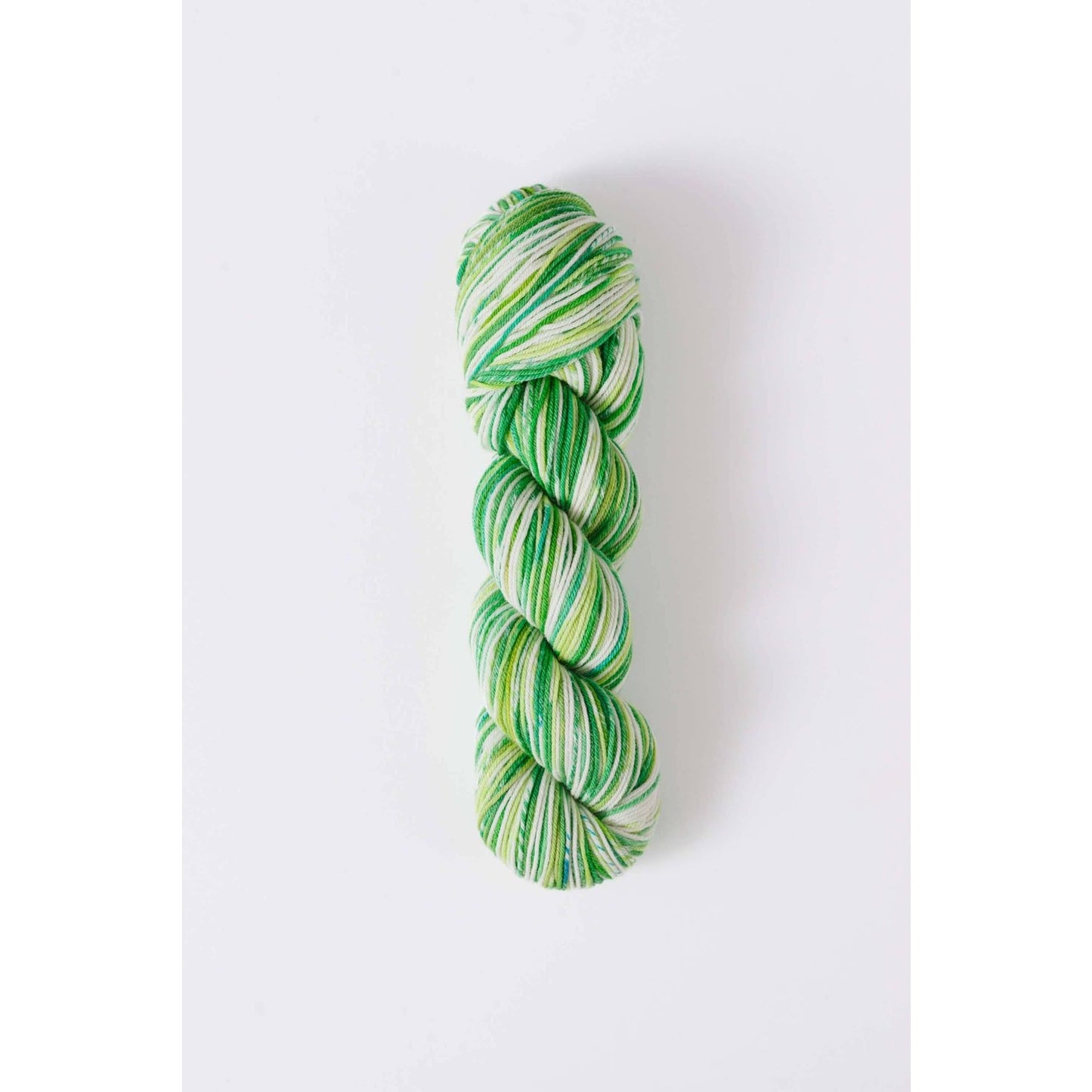 Quince & Co. green and white superwash merino fingering yarn skein for knitting and crocheting