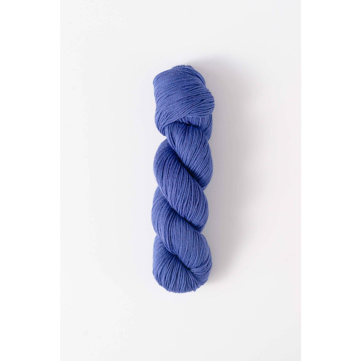 Quince and Co superwash merino fingering yarn in a soft blue color for knitting and crochet